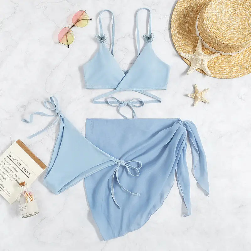 Light blue bikini set with a wrap-style bottom.