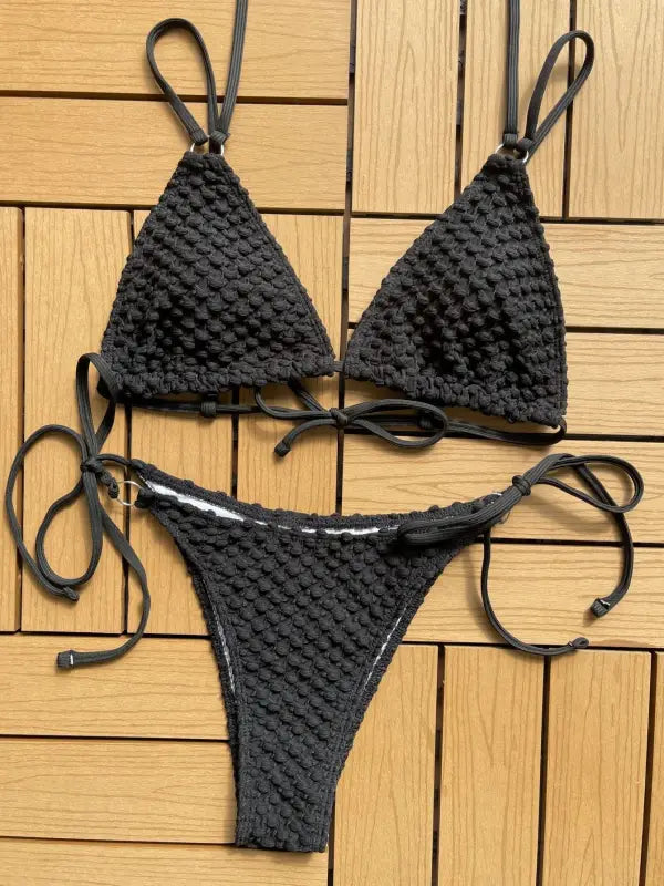 Black crocheted bikini with triangle top and tie-side bottom.