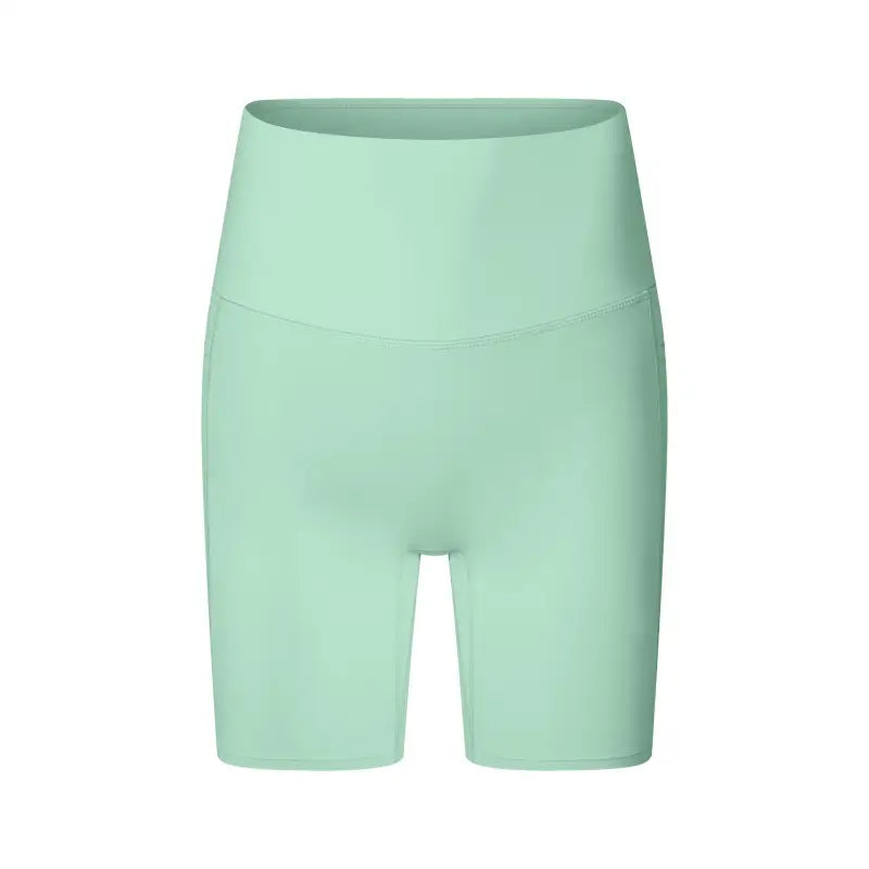 Mint green high-waisted workout shorts or cycling shorts.