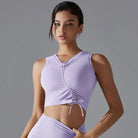 Lavender crop top with ruched front detailing and drawstring.