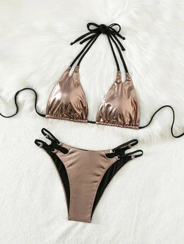 Metallic rose gold bikini with black tie straps and side clasps.