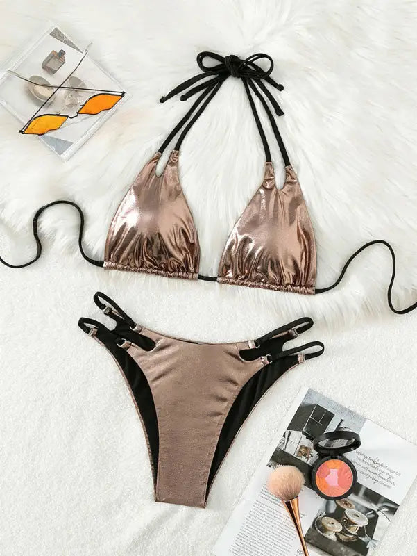 Metallic rose gold bikini with black tie straps and side clasps.