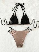 Two-piece bikini swimsuit with a black triangle top and metallic rose gold bottom.