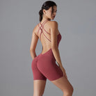 Maroon bodysuit with criss-cross back straps and short legs.